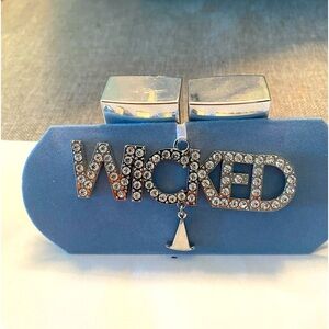 Just in time for WICKED.  This rhinestone ornament can be used to hang anywhere.